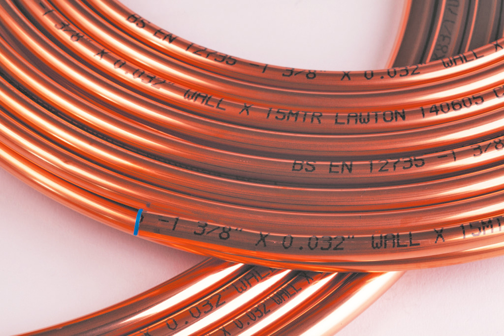 Close-up: Copper coiled tubes with marked specifications