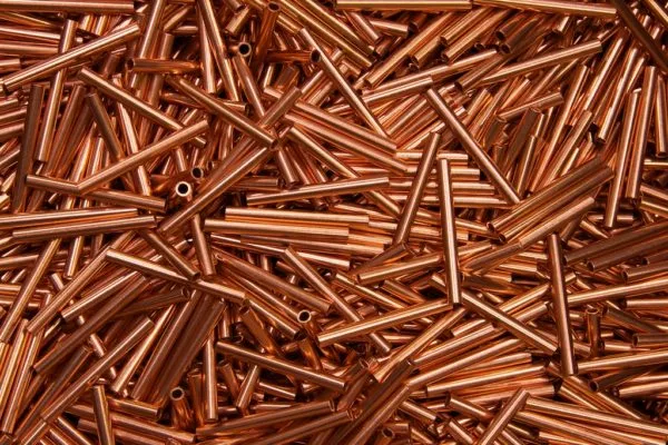 An array of short, shiny copper tubes